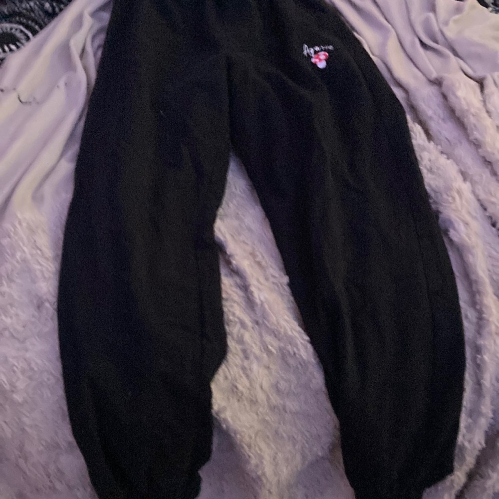 Black baggy pants with mushroom on it <3